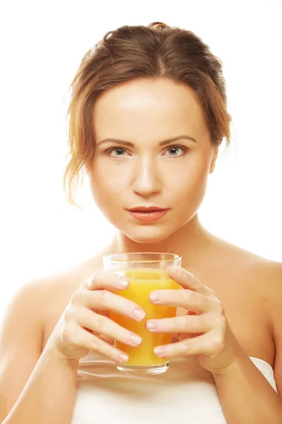 Woman isolated shot drinking orange juice — Stock Photo, Image