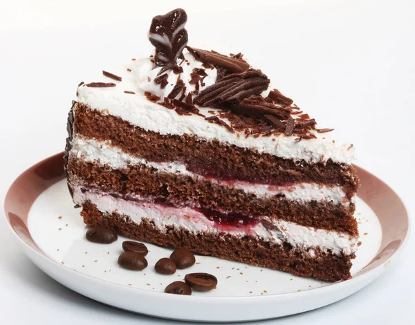 Süße Torte vor weißem Hintergrund aus nächster Nähe — Stockfoto