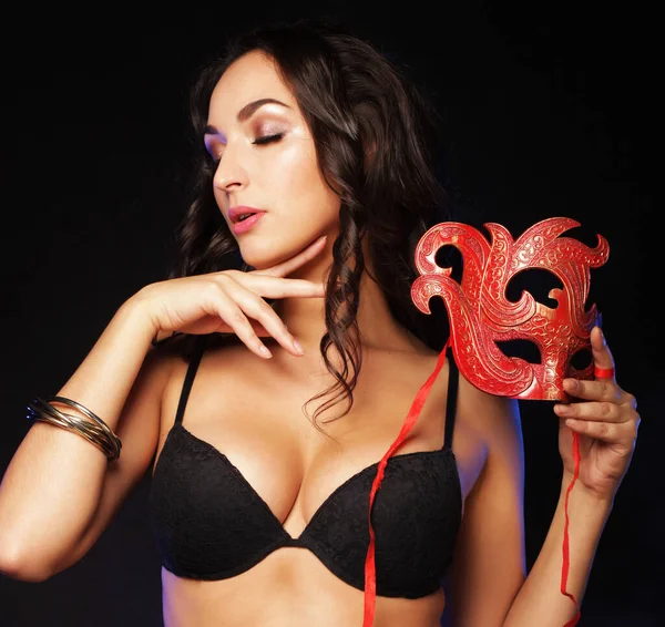 Joven sexy striptease bailarina con máscara roja —  Fotos de Stock