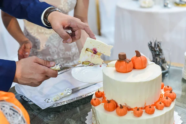 Wedding cake with red roses. orange