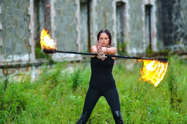 Fire show girl with flaming torches — Stock Photo, Image