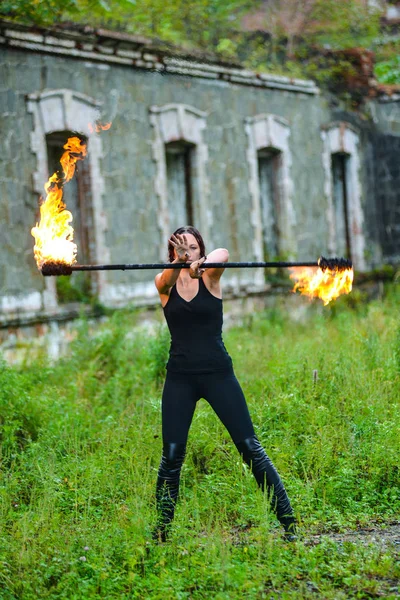 Fire show girl with flaming torches — Stock Photo, Image