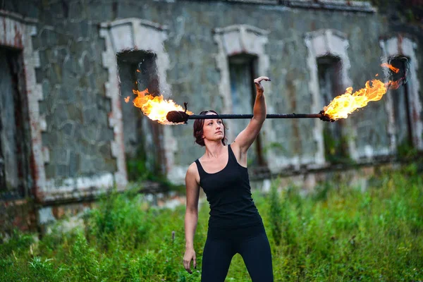 Fire show girl with flaming torches — Stock Photo, Image