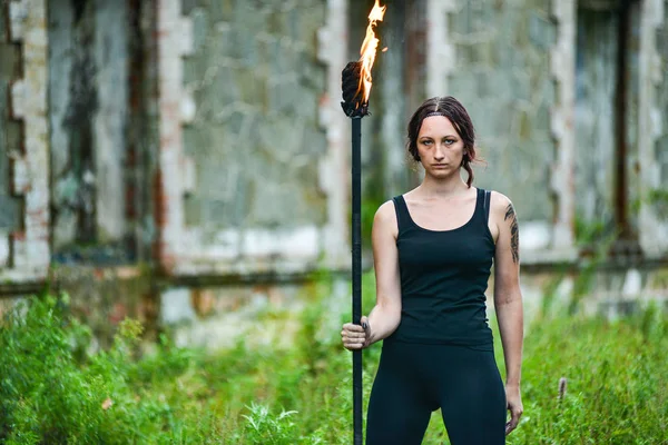 Fire show girl with flaming torches — Stock Photo, Image