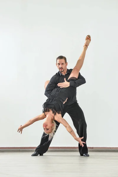 Couple dancing isolated over white background