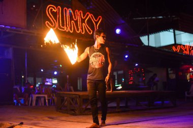 Fire show on Phi Phi island in Thailand at the bar Sunky clipart