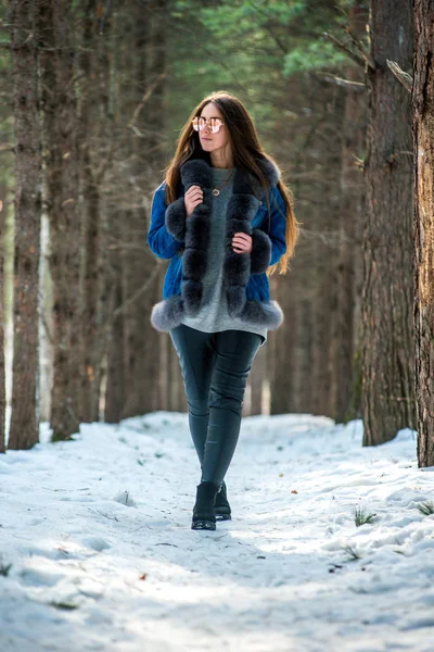 Young hipster woman in winter forest having fun with snow — Stock Photo, Image