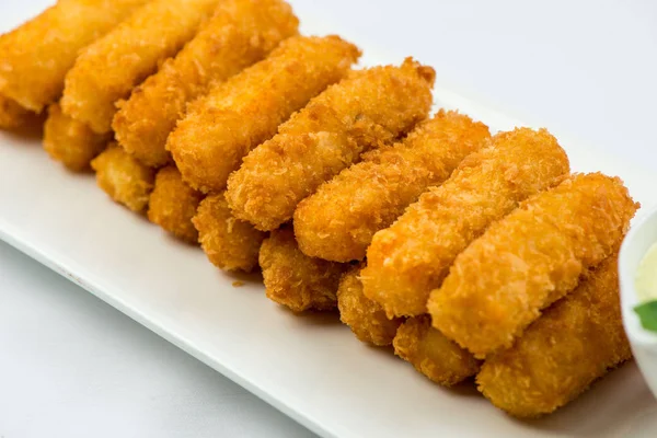 Meat fried in batter with dill in squared plate over white background — Stock Photo, Image