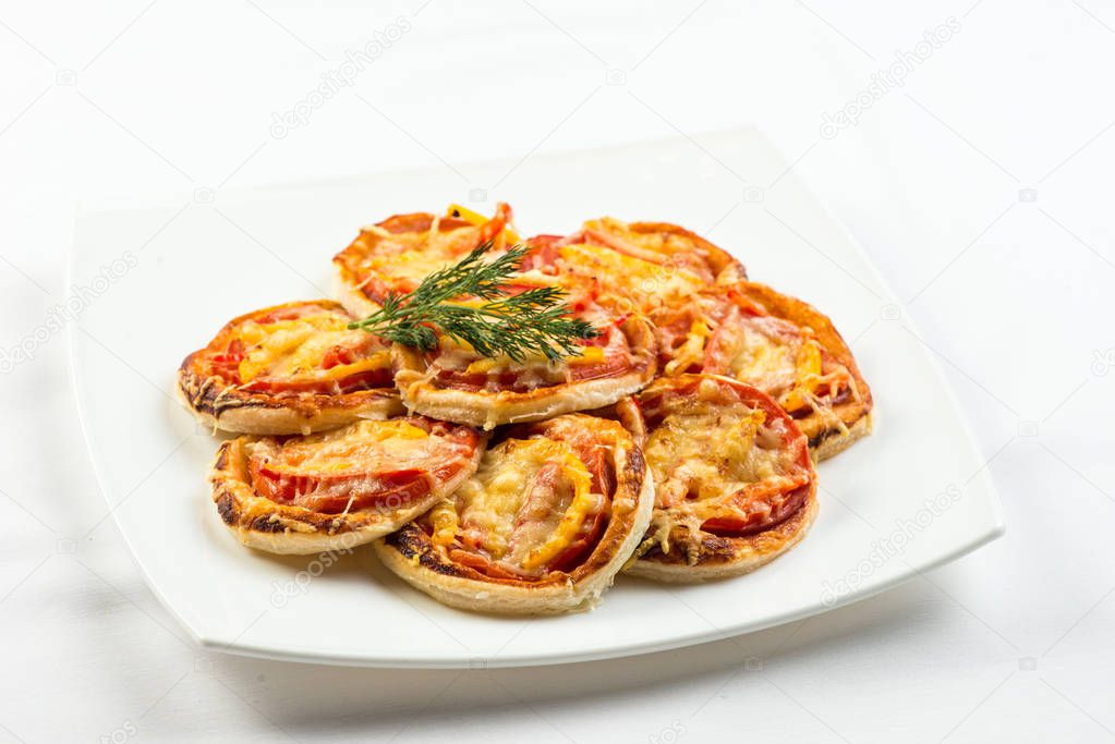 Mix of mini pizzas on a stone try , on white background