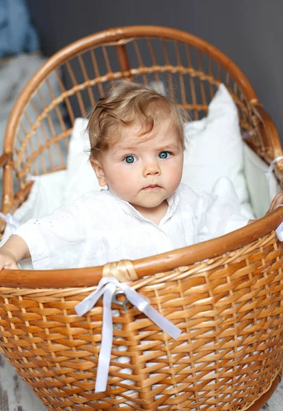 Baby Sitting Wicker Crib Royalty Free Stock Images