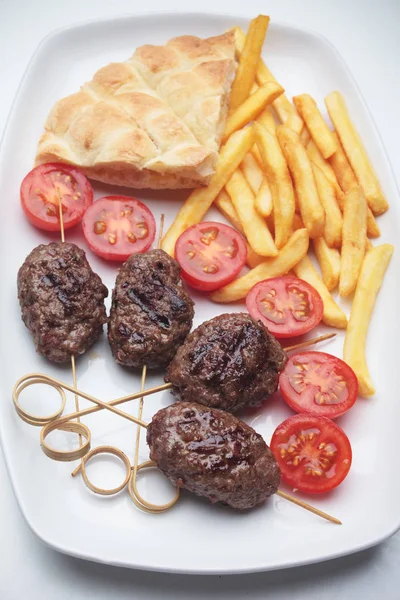 Kofta kebab with french fries and pita bread — Stock Photo, Image