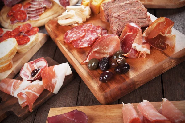 Charcuterie board with cured meat — Stock Photo, Image