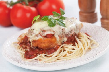 Chicken parmesan with spaghetti pasta clipart