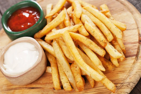 French fries with ketchup and mayonnaise — Stock Photo, Image