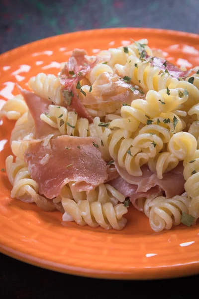 Italian pasta with prosciutto — Stock Photo, Image