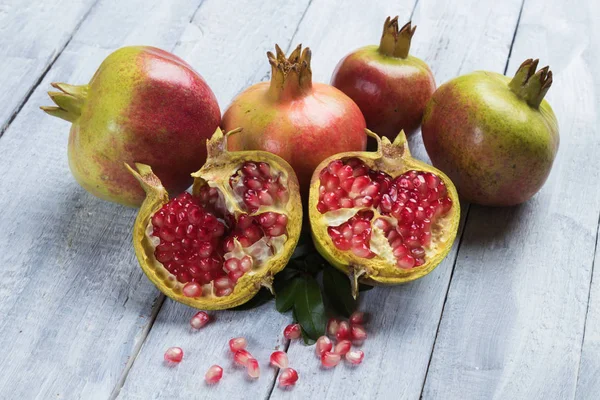 Ripe pomegranate fruit, opened with red seeds — 스톡 사진