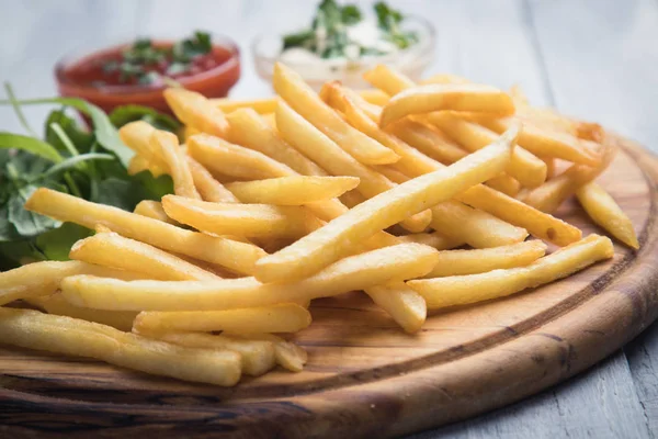 French fries with ketchup and mayonnaise — Stock Photo, Image