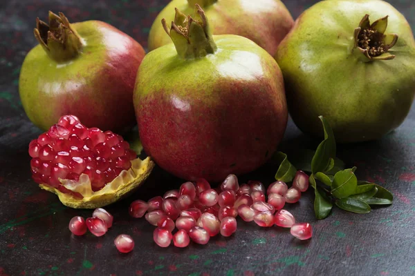 Ripe pomegranate fruit, opened with red seeds — 스톡 사진