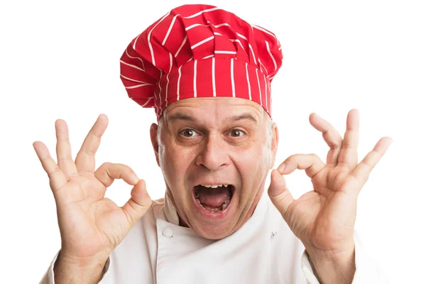 Kırmızı şapkalı aşçı surat yapıyor. — Stok fotoğraf