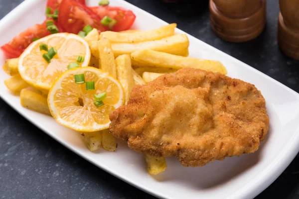 Breaded cutlet with french fries — Stock Photo, Image