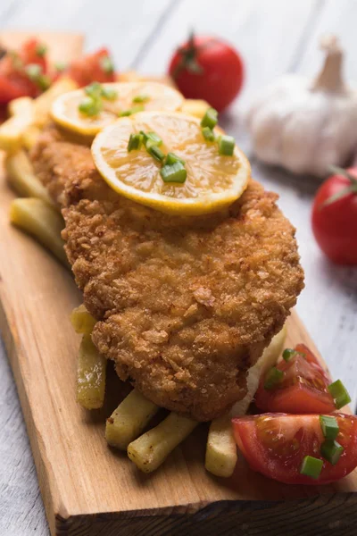 Breaded cutlet with french fries — Stock Photo, Image