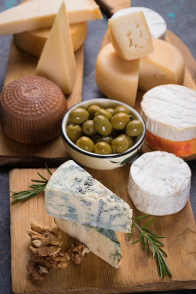 Aged cheese round and slices — Stock Photo, Image