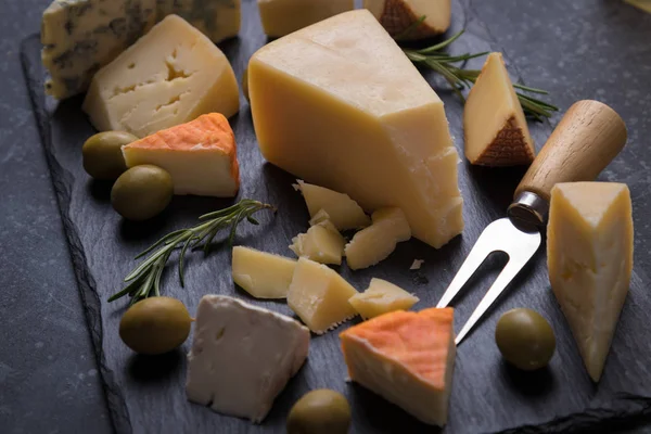 Aged cheese round and slices — Stock Photo, Image