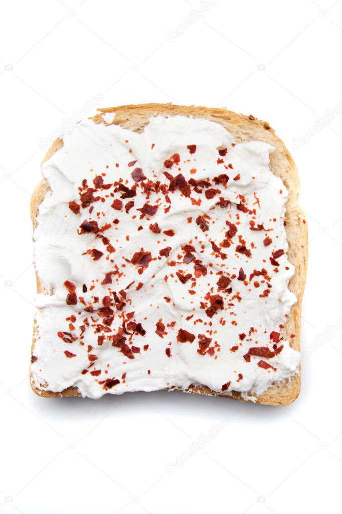 Slice of bread with sour cream spread on top