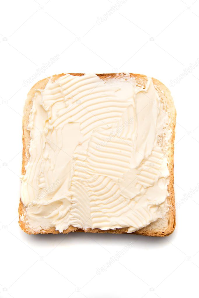 Slice of bread with butter spread on top