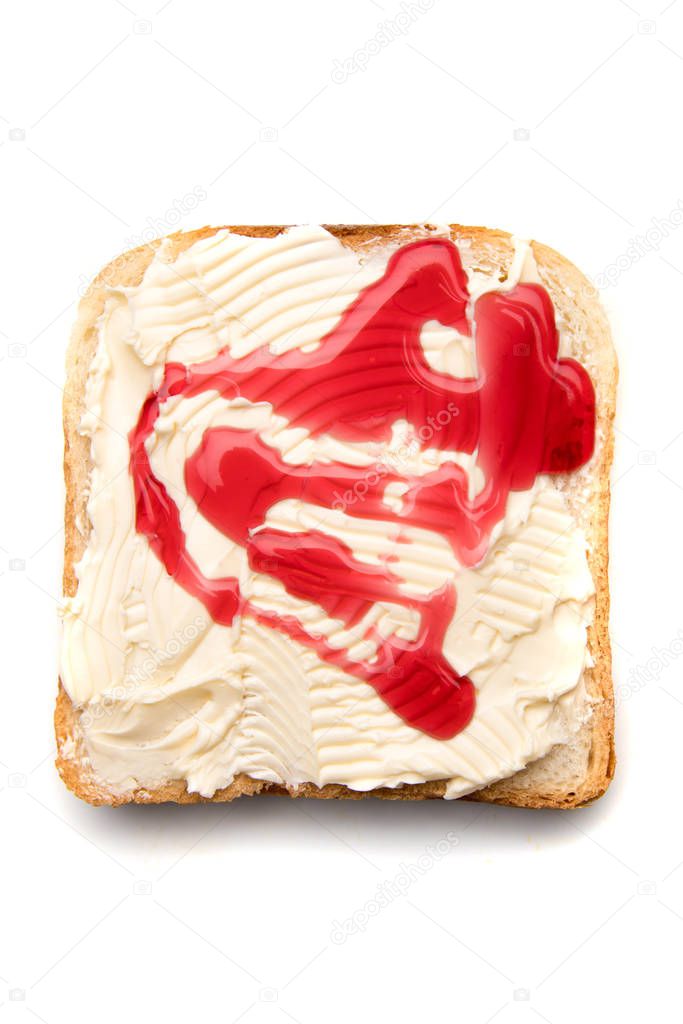 Slice of bread with butter and jelly spread on top