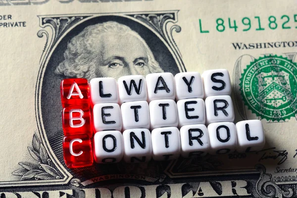 ABC Always Better Control em notas de dólar Fotos De Bancos De Imagens
