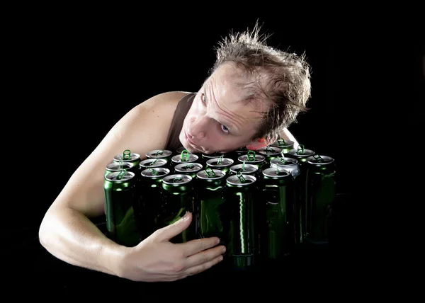 Hangover.The drunk man and is a lot of empty beer cans — Stock Photo, Image