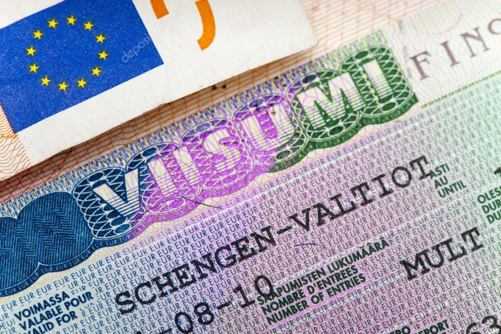 Schengen visa of Finland on the page of the passport, close up