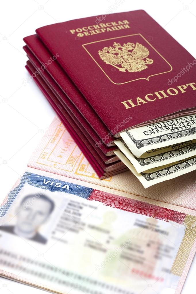 The American visa on page of the Russian international passport and US dollars