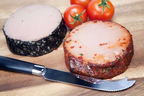 Two meat pastes, special knife and tomato — Stock Photo, Image