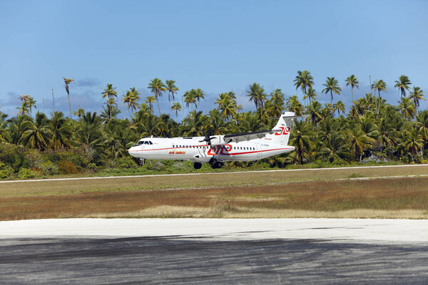 POLINESIA- JUNE 16:  screw plane - ATR 72 Air Tahiti companies makes landing on the small tropical island Tikehau on june 16, 2011 in French Polynesia