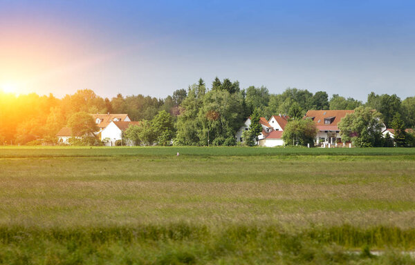 Rural areas in Germany, Bavaria, with brightly green fields and trees small an