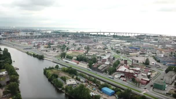 Drone view of the industrial part of St. Petersburg, Kanonersky island with Western high-speed diameter and the Gulf of Finland on the horizon.shot in 4K UHD — стоковое видео