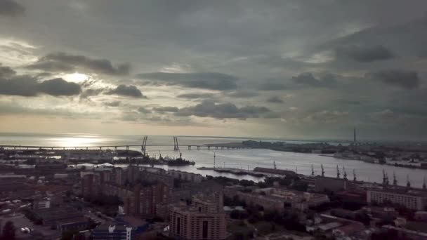 Drone view of the industrial part of St. Petersburg, Kanonersky island with Western high-speed diameter and the Gulf of Finland on the horizon.Shot in 4k Uhd — Αρχείο Βίντεο