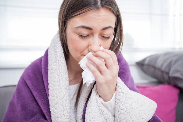 Young ill woman at home