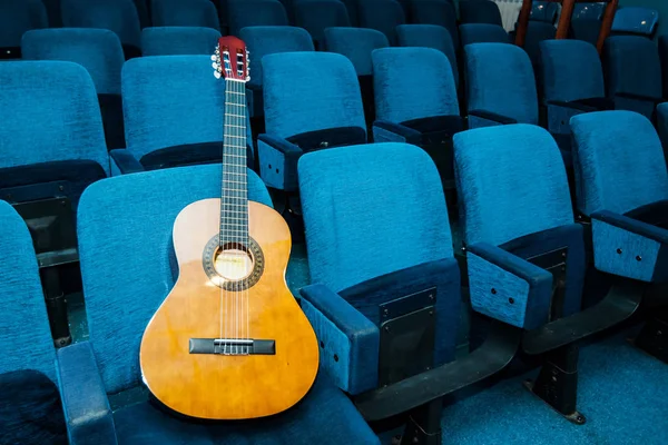 Classic guitar in empty conference room