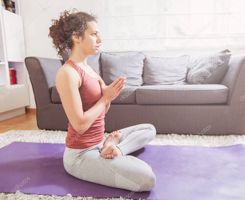 Woman Practicing Yoga and Meditation