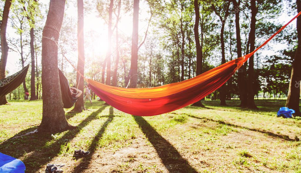 Colorful hammock in the park at sunset on a summer day.