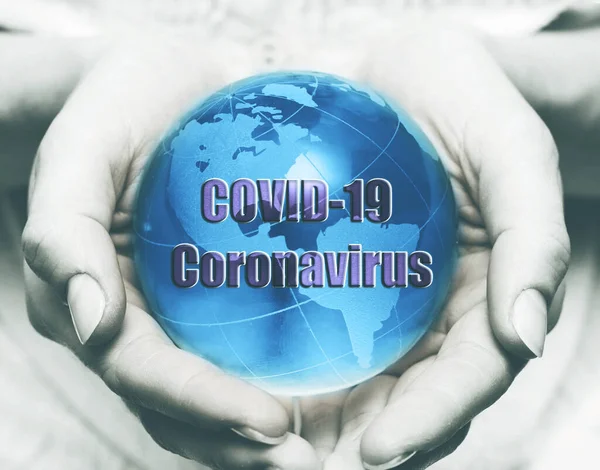 Coronavirus Covid-19 pandemic concept. Earth globe on human hands, virus spreads all around world.