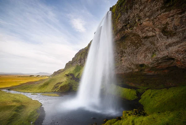 Seljalandsfoss Waterfall on a Sunny Day in Iceland Royalty Free Stock Images