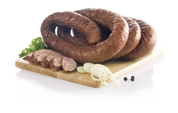 Traditional smoked sausage on the wooden board isolated on white — Stock Photo, Image