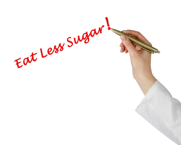 Käsin kirjoittaminen "Syö vähemmän sokeria " — kuvapankkivalokuva