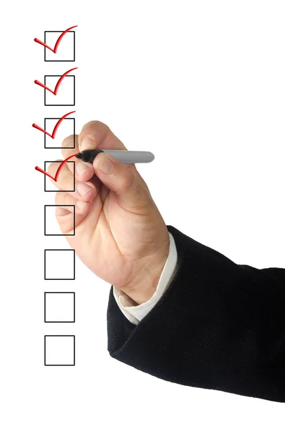 Man with pen  Filling checklist — Stock Photo, Image