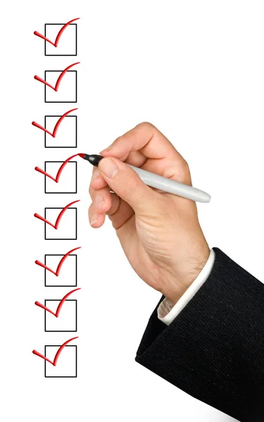 Man Filling checklist with red marks — Stock Photo, Image