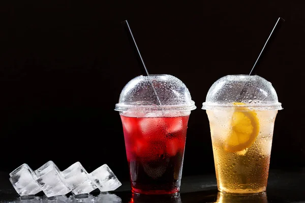 various iced tea in takeaway plastic cups